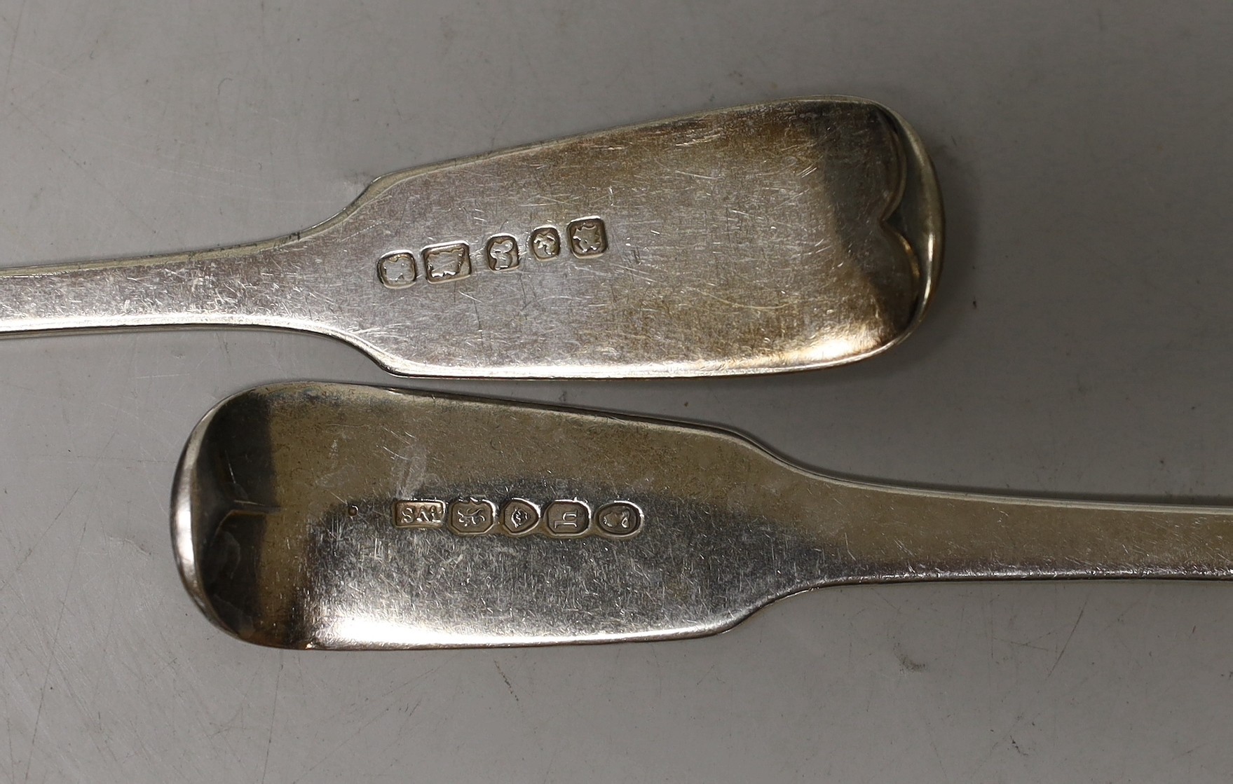 Four assorted 19th century silver table spoons, 9.5oz and two plated spoons.